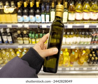 choosing a dairy products at supermarket	.oil,  ham, sauce, olives at the grocery store - Powered by Shutterstock