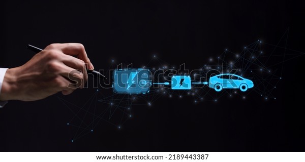 Choosing an electric vehicle. electric car\
choice. pointing at symbol on charging machine. electric car\
production Virtual Technology AR Augmented Reality or VR Virtual\
Reality metaverse