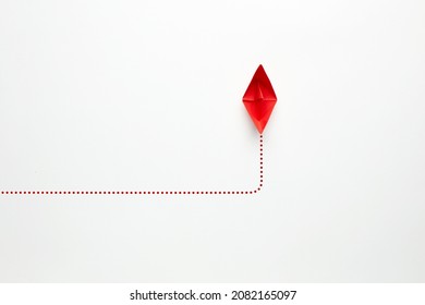 Choosing The New, Right Or Alternative Change Path In Business Concept. Red Paper Boat Changes Direction On White Background. 