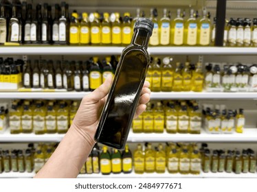 choosing olive oil, sauce, vinegar at the grocery store - Powered by Shutterstock