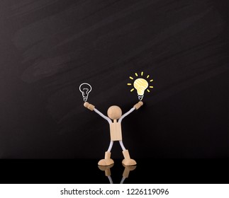 Choosing Process Concept, Wooden Stick Figure Arms Up, Holding Big Yellow Light Bulb Sketch, On A Chalkboard, Right Choice.