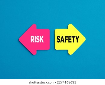 Choosing risky way or safe way alternative options. The words risk and safety on arrows pointing on opposite directions.