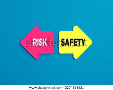 Choosing risky way or safe way alternative options. The words risk and safety on arrows pointing on opposite directions.