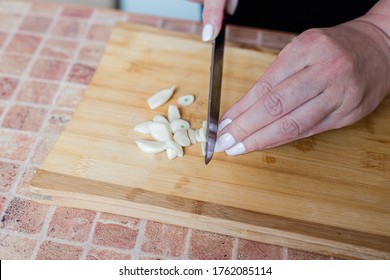 
Chop The Garlic On A Wooden Board, Cooking Instruction