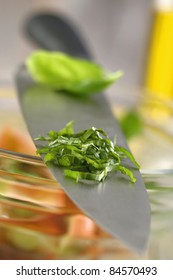 Chopped Basil On The Blade Of A Knife