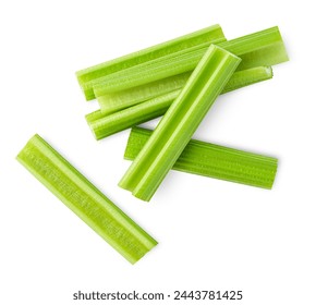 chopped celery stalks on isolated white background, top view