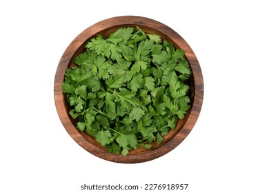 Chopped fresh parsley leaves in a wooden bowl, isolated on white background, top view - Shutterstock ID 2276918957