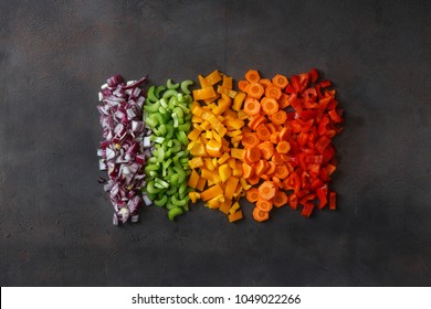 Chopped Fresh Vegetables On Dark Background, Top View