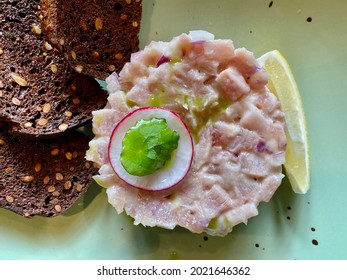 Chopped Frozen Atlantic Bonito Fish, One Of The Types Of Stroganina Dish, Traditional Baltic Food, Close Up Photo