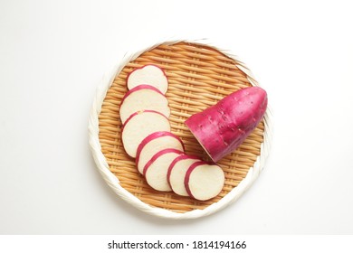 Chopped Japanese sweet potato on bamboo basket for autumn cooking ingredient