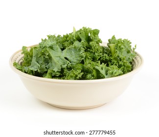 Chopped Kale Salad In A Bowl Isolated On A White Background.