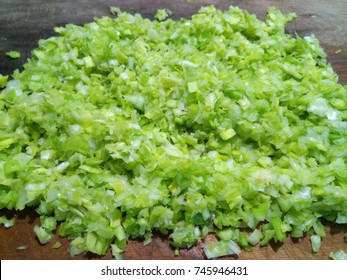 Chopped Leek On A Wooden Board