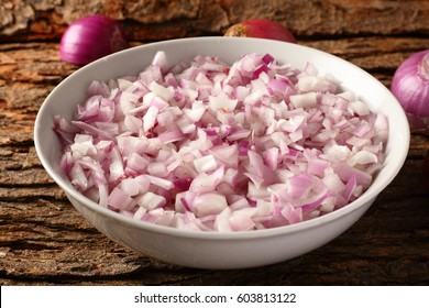 Chopped Organic Red Onions Served In White Bowl.