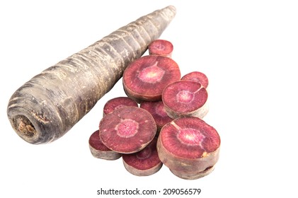 Chopped Purple Carrot Over White Background