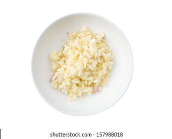 Chopped And Slices Of Garlic In White Bow On Wooden Table