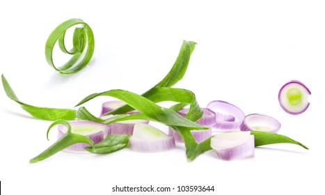 Chopped Spring Onions On A White Background, Closeup