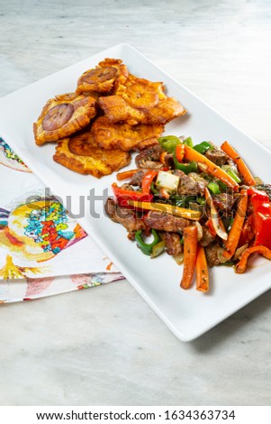 Chopped steak or Bistec Picao and patacones or tostones are fried green plantain slices, made with green plantains, tipical Panamá food, Panamá, Central America
