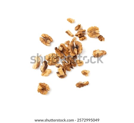 Chopped wallnut , broken roasted walnuts powder, heap of nuts crumbs, whole kernel pieces, fractions, powder top view on white background