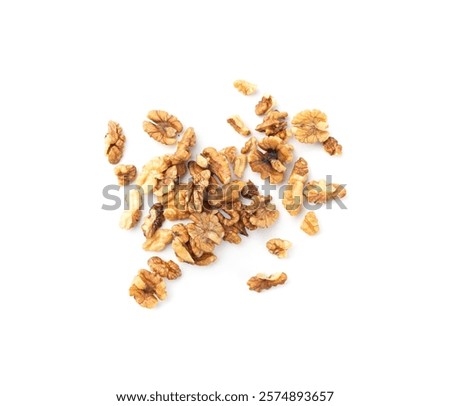Chopped wallnut , broken roasted walnuts powder, heap of nuts crumbs, whole kernel pieces, fractions, powder top view on white background
