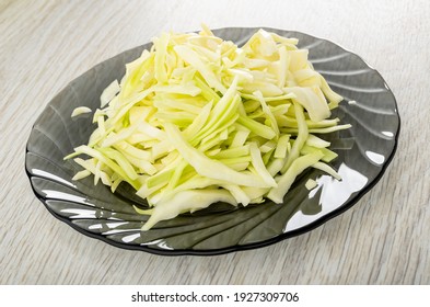 Chopped White Cabbage In Gray Transparent Plate On Wooden Table