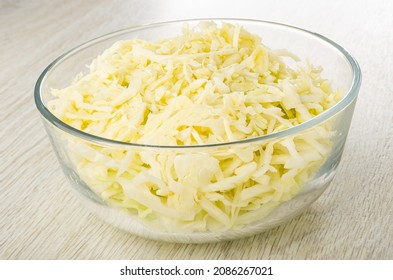 Chopped White Cabbage In Transparent Glass Bowl On Wooden Table