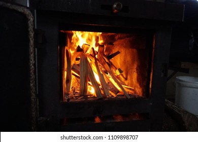 Chopped Wood Burning With Flames In A Stove