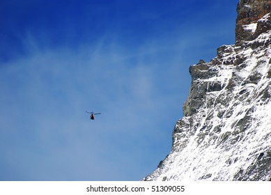 Chopper Of The Air Zermatt In Front Of The Matterhorn East Wall.