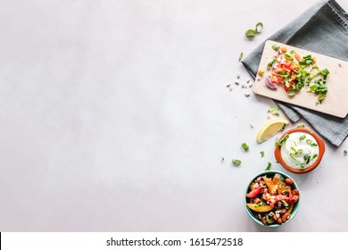 Chopping board and tea or dish towel salsa flat lay background or backdrop with copy space - Shutterstock ID 1615472518