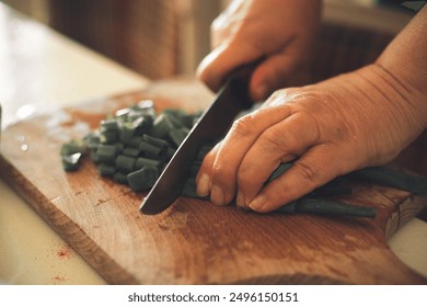 Chopping vegetables. Close-up of hands and fingers chopping scallions. - Powered by Shutterstock