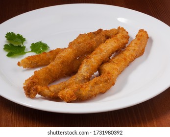 Chopsticks Chicken In Batter On A White Plate