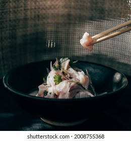 Chopsticks Grabbing White Fish From Ceviche Bowl 