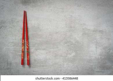 Chopsticks On Gray Concrete Stone Table Background