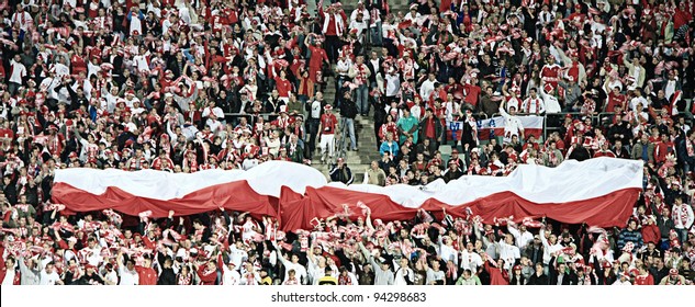 CHORZOW - SEPTEMBER 5: Polish Fans In Slaski Stadium Cheer During The 2010 FIFA World Cup Qualification Match Between Poland And Northern Ireland On September 5, 2009 In Chorzow, Poland.