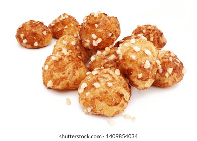 Chouquettes (French sugar puffs) isolated on white