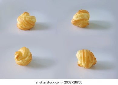 Choux Cream Cake Traditional French Dessert Displayed On Wooden Board. Tasty Creampuff Choux Isolated On White Background                