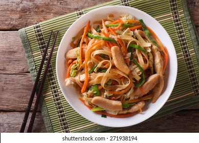 Chow Mein: fried noodles with chicken and vegetables close-up. horizontal view from above  - Shutterstock ID 271938194