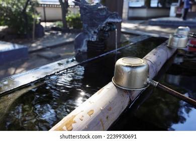 Chozuya purification fountain ladles. traditional japanese shinto washbasing for ritual cleansing of worshippers at the shrine entrance - Shutterstock ID 2239930691