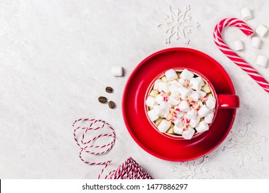 Chrismas Marshmellow Coffee In Red Cup On White Marble Background, Christmas Decor. Top View, Space For Text.