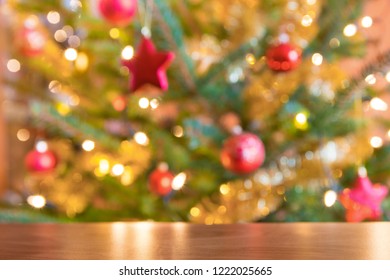 Chrismas Table In Front Of Defocused Chrismas Tree. 