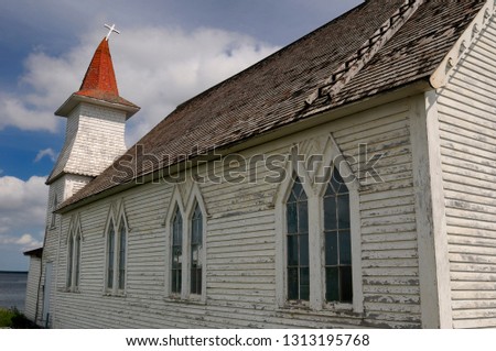 Christ Anglican Church with bent steeple and cross at Clarke's Head Gander Bay Newfoundland