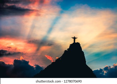 Christ the Redeemer, Cristo redentor at sunset, in Rio de Janeiro - Brazil
