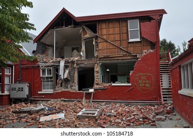 CHRISTCHURCH, NEW ZEALAND - MARCH 12: A Brick House On Historic Cranmer Square Collapses From The Impact Of The Massive  Earthquake On March 12, 2011 In Christchurch.