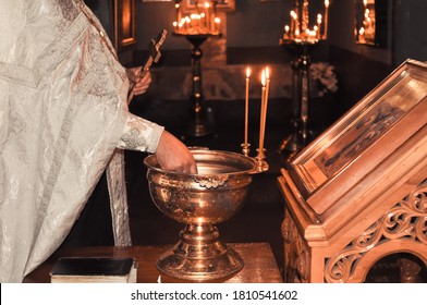 Christening  Baby  In The Church By Priest, Holy Water 