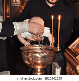 Christening  Baby  In The Church By Priest, Holy Water 