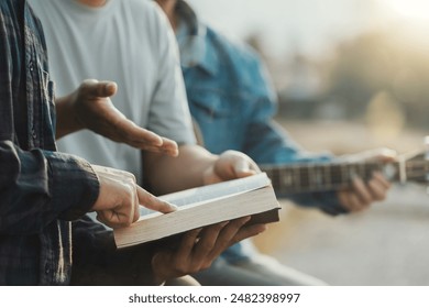 Christian Bible Study Concepts. Christian friend groups read and study the bible together in the park. sharing the gospel with a friend. followers are learning the word of God. praying to God. - Powered by Shutterstock