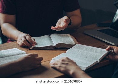 Christian Bible Study Concepts. Christian friend's groups read and study the bible together in a home with window light. followers are studying the word of God in churches. - Shutterstock ID 2151098867