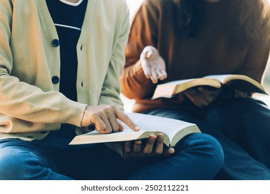 Christian Bible Study Concepts. Christian friends read and study the bible together in the park. followers are studying the word of God in churches. sharing the gospel with a friend. Education