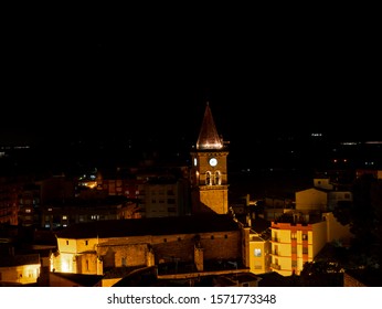 
Christian cathedral with tower and clock illuminated at night - Powered by Shutterstock