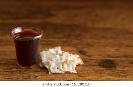 Christian Communion on a Wooden Table - Shutterstock ID 1103281283