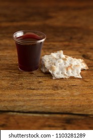 Christian Communion on a Wooden Table - Shutterstock ID 1103281289